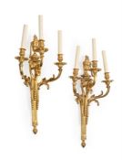 A PAIR OF ORMOLU TRIPLE BRANCH WALL APPLIQUES, IN LOUIS XVI STYLE, 20TH CENTURY