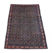 A PERSIAN FERAGHAN CARPET