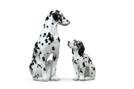 A LARGE GLAZED TERRACOTTA DALMATION OR CARRIAGE DOG AND A YOUNGER COMPANION, 20TH CENTURY
