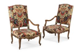 A PAIR OF CARVED WALNUT AND NEEDLEWORK UPHOLSTERED FAUTEUILS, IN REGENCY STYLE, 19TH CENTURY