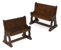 A PAIR OF VICTORIAN OAK GOTHIC REVIVAL PEWS OR HALL BENCHES, CIRCA 1860