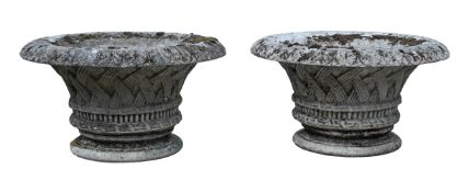 A PAIR OF CAST STONE CIRCULAR GARDEN URNS, 20TH CENTURY
