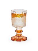 A BOHEMIAN AMBER-FLASHED AND ENGRAVED HEXAGONAL SECTION GOBLET, CIRCA 1860