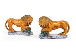 A PAIR OF SICILIAN MAIOLICA POTTERY FIGURES OF MEDICI LIONS, MODERN