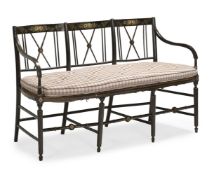 A REGENCY STYLE EBONISED AND PARCEL GILT TRIPLE CHAIR BACK SETTEE, FIRST QUARTER 19TH CENTURY