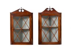A MATCHED PAIR OF GEORGE III GLAZED HANGING CORNER CUPBOARDS, CIRCA 1800