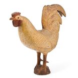 A NORTH EUROPEAN FOLK ART CARVED AND PAINTED BEECHWOOD FIGURE OF A COCKEREL, 20TH CENTURY