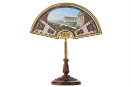Y A GRAND TOUR FAN PANEL SET IN A GLAZED GILT METAL AND ROSEWOOD TABLE FRAME
