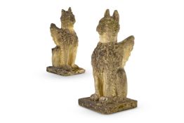 A PAIR OF CAST COMPOSITION STONE GRIFFIN GATE FINIALS