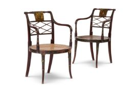 A PAIR OF REGENCY SIMULATED MAHOGANY AND POLYCHROME DECORATED ARMCHAIRS