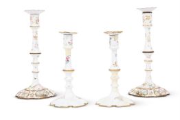 TWO PAIRS OF GEORGE III STAFFORDSHIRE ENAMEL CANDLESTICKS