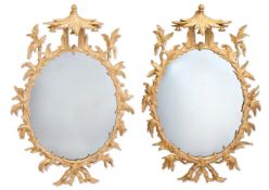 A PAIR OF GEORGE III GILTWOOD OVAL MIRRORS, CIRCA 1760