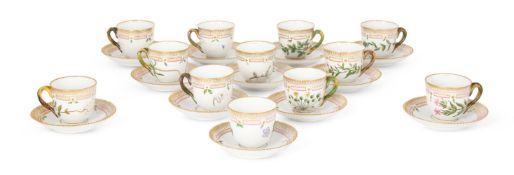 A SET OF TWELVE ROYAL COPENHAGEN FLORA DANICA PORCELAIN COFFEE CUPS AND SAUCERS