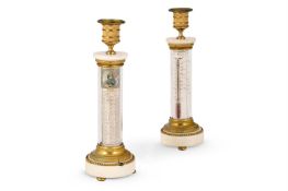 A RARE PAIR OF FRENCH ORMOLU AND WHITE MARBLE CANDLESTICKS