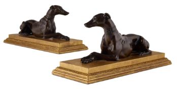 A PAIR OF BRONZE GREYHOUNDS OR WHIPPETS