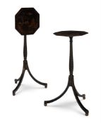 A NEAR PAIR OF BLACK AND GILT JAPANNED TRIPOD TABLES