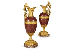 A PAIR OF FRENCH ORMOLU MOUNTED ROUGE MARBLE EWERS