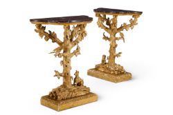 A PAIR OF GILTWOOD AND COMPOSITION CONSOLE TABLES, IN THE MANNER OF THOMAS JOHNSON