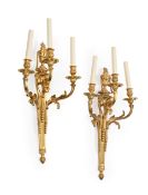 A PAIR OF ORMOLU TRIPLE BRANCH WALL APPLIQUES, IN LOUIS XVI STYLE, 20TH CENTURY
