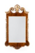 A GEORGE II WALNUT AND PARCEL GILT KENTIAN TYPE WALL MIRROR, CIRCA 1750 AND LATER PLATE