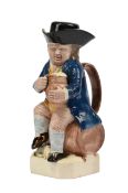 A STAFFORDSHIRE CREAMWARE TOBY JUG AND COVER WITH SLEEPING DOG, CIRCA 1800