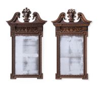 A PAIR OF CARVED WOOD AND PARCEL GILT WALL MIRRORS, LATE 19TH OR EARLY 20TH CENTURY