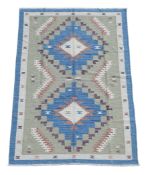 A HAND KNOTTED KELIM CARPET, MODERN