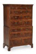 A GEORGE II CROSSBANDED WALNUT AND OAK CHEST ON CHEST, CIRCA 1740