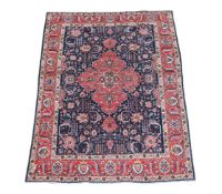 AN INDIGO BLUE TABRIZ CARPET
