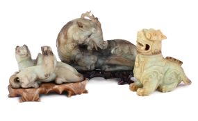 A CHINESE CELADON, JADE FIGURE OF A SEATED MARE WITH A PONY