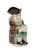 A STAFFORDSHIRE PEARLWARE TOBY JUG, CIRCA 1800
