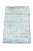 A BLUE GROUND MODERN HAND KNOTTED MOROCCAN CARPET, MODERN