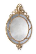 A GILTWOOD OVAL WALL MIRROR, IN THE MANNER OF JOHN LINNELL, LATE 19TH OR 20TH CENTURY