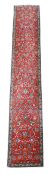 A RED GROUND TABRIZ RUNNER
