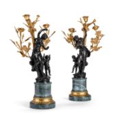 AFTER AUGUSTE MOREAU, A PAIR OF PATINATED AND GILT BRONZE FIGURAL CANDELABRA, LATE 19TH CENTURY