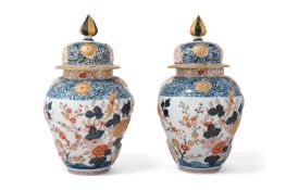 A PAIR OF JAPANESE IMARI VASES AND COVERS, 19TH CENTURY