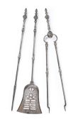 A SET OF THREE GEORGE III ENGRAVED STEEL FIRE TOOLS, LATE 18TH OR EARLY 19TH CENTURY
