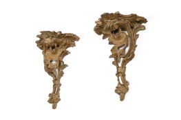 A PAIR OF GEORGE III CARVED AND OCHRE PAINTED WALL BRACKETS, CIRCA 1770