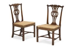 A PAIR OF GEORGE III MAHOGANY SIDE CHAIRS, IN THE MANNER OF THOMAS CHIPPENDALE, CIRCA 1770