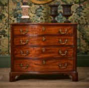 A GEORGE III MAHOGANY AND CROSSBANDED SERPENTINE CHEST OF DRAWERS, CIRCA 1765