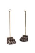A PAIR OF ROSSO LEVANTO MARBLE AND BRASS 'LION PAW' DOOR STOPS OR DOOR PORTERS