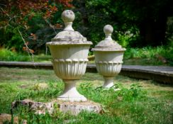 A PAIR OF COMPOSITION STONE URN FINIALS, 20TH CENTURY