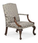 A CARVED MAHOGANY AND UPHOLSTERED GAINSBOROUGH ARMCHAIR, IN GEORGE III STYLE, 19TH CENTURY