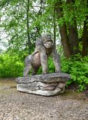 A LIFESIZE COMPOSITION STONE FIGURE OF A MALE GORILLA, LATE 20TH CENTURY