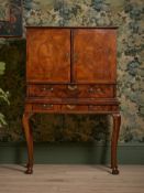 A GEORGE I FIGURED WALNUT AND CROSSBANDED CHEST ON STAND, CIRCA 1720
