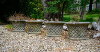 A SET OF FOUR COMPOSITION STONE BASKET WEAVE PLANTERS, 20TH CENTURY