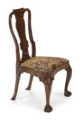 A GEORGE II WALNUT AND NEEDLEWORK UPHOLSTERED CHAIR, IN THE MANNER OF GILES GRENDEY, CIRCA 1730