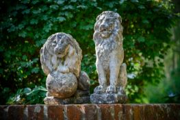 A PAIR OF CARVED STONE MODELS OF A LION AND LIONESS, 20TH CENTURY