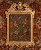 A GEORGE II CARVED GILTWOOD MIRROR, CIRCA 1740