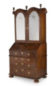 A QUEEN ANNE WALNUT AND FEATHERBANDED BUREAU BOOKCASE, CIRCA 1710